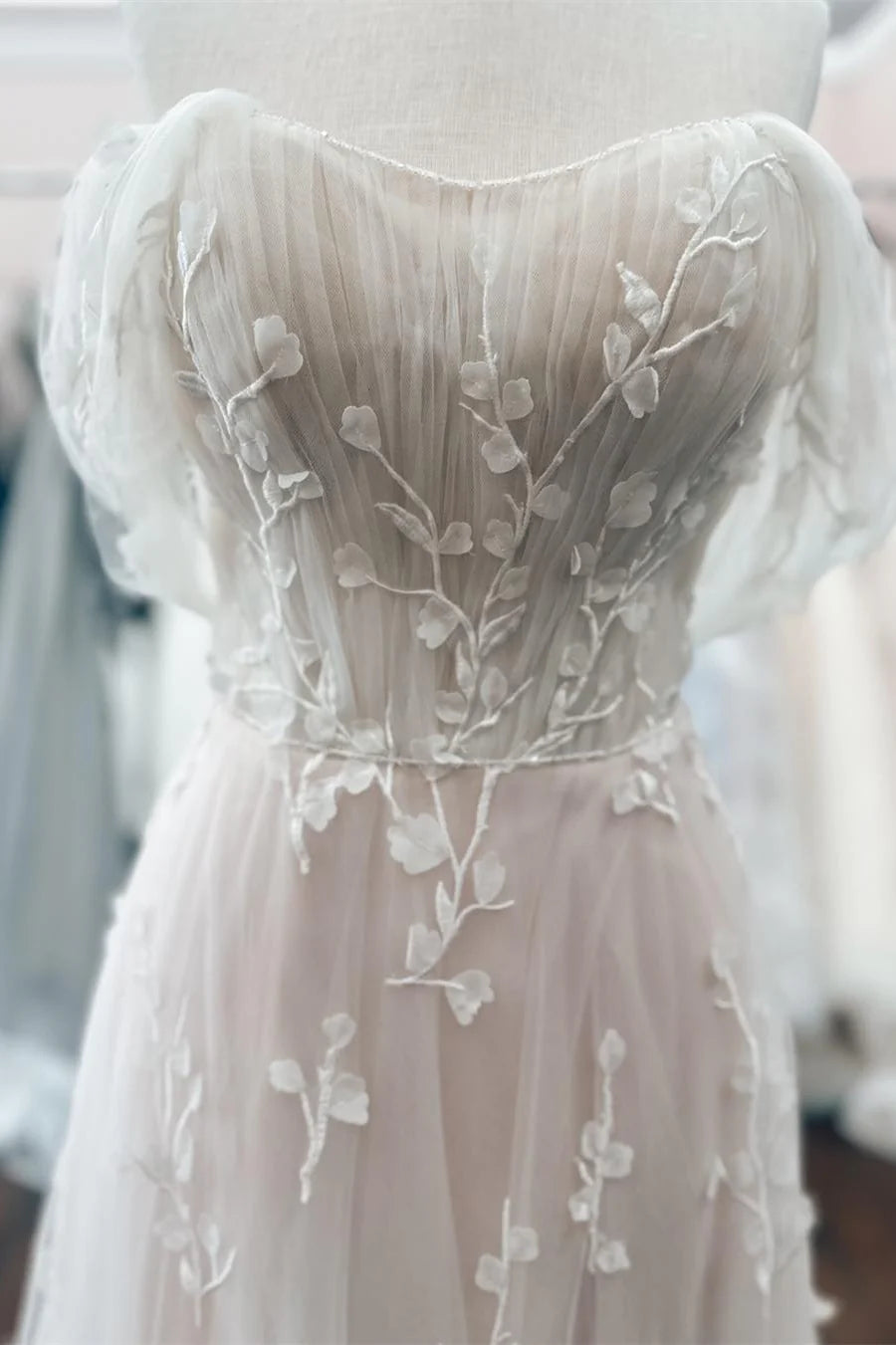 Blush Off-the-Shoulder Wedding Dress with Floral Appliques and Tulle Train