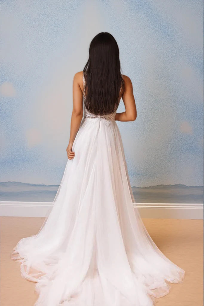 Bohemian tulle wedding dress with spaghetti straps, beaded lace bodice and beaded waist belt