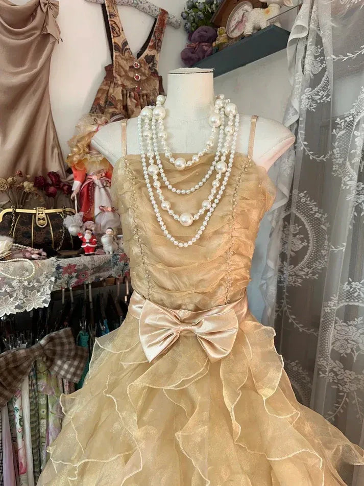 Champagne Spaghetti Strap Ruffled Tulle Gown with Satin Bow