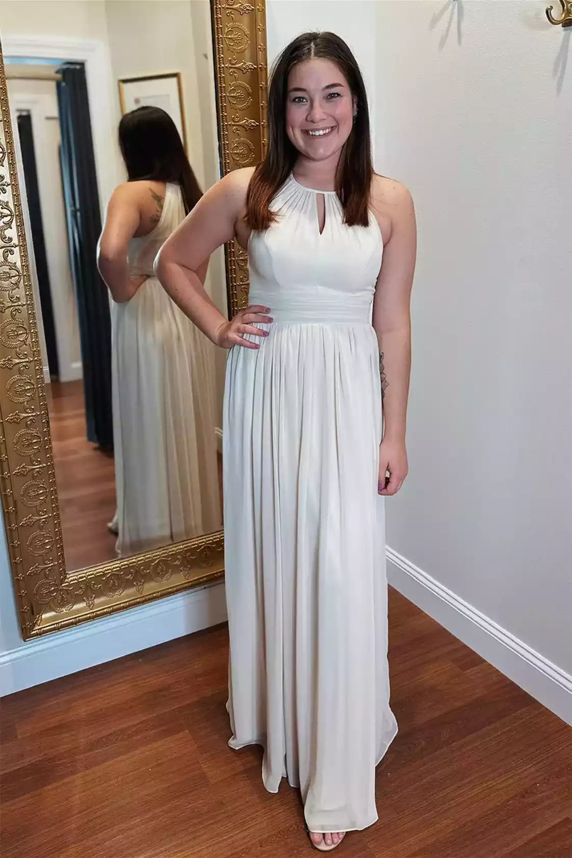 Elegant Ivory Chiffon Gown with Halter Keyhole Neck & Pleated Skirt