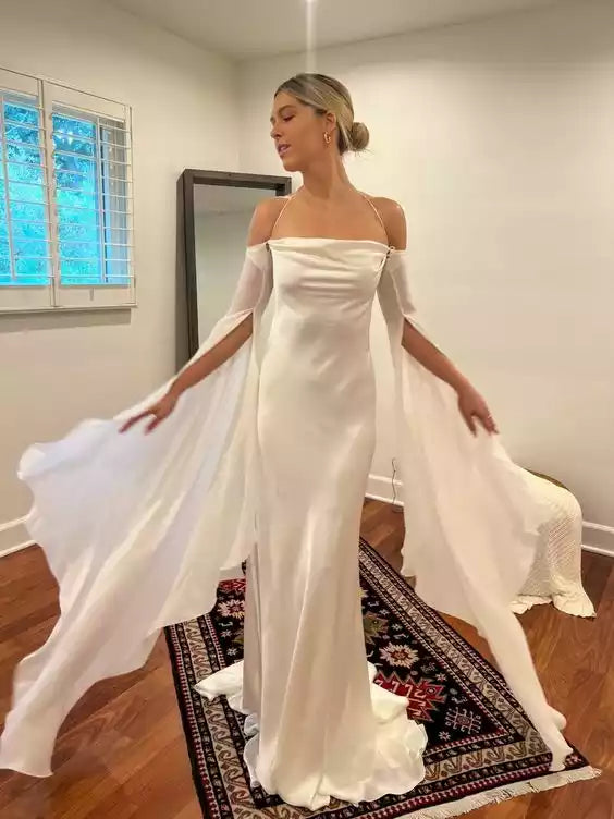Ethereal Ivory Satin Cold-Shoulder Gown with Flowing Cape Sleeves