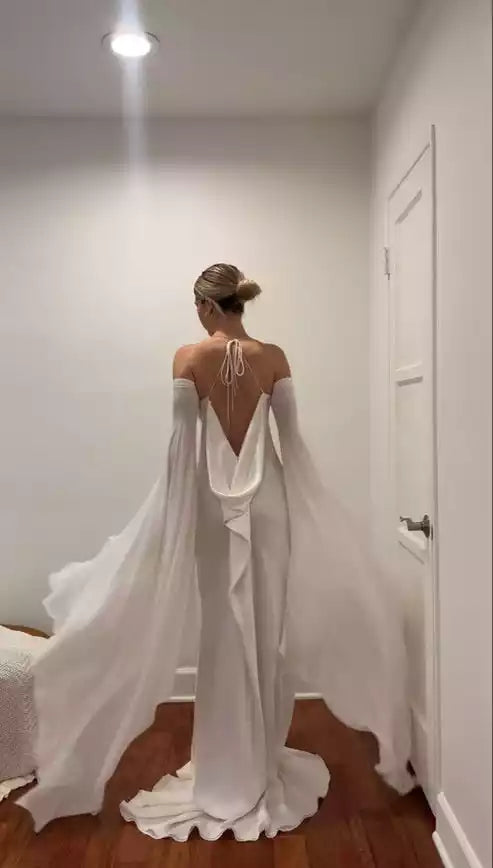 Ethereal Ivory Satin Cold-Shoulder Gown with Flowing Cape Sleeves