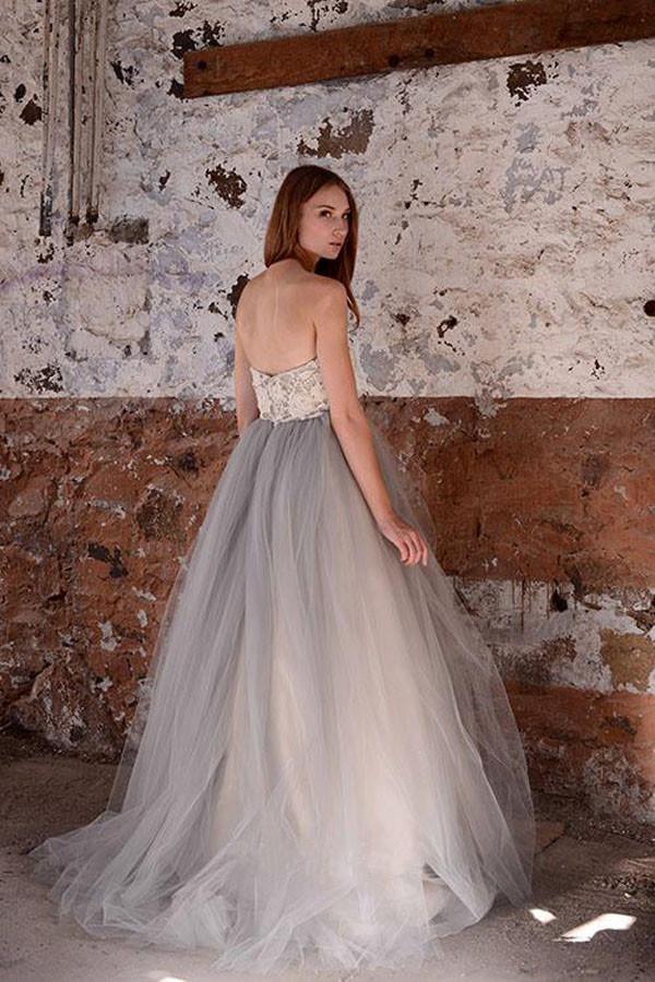 Ethereal strapless tulle wedding dress with beaded lace bodice and voluminous skirt