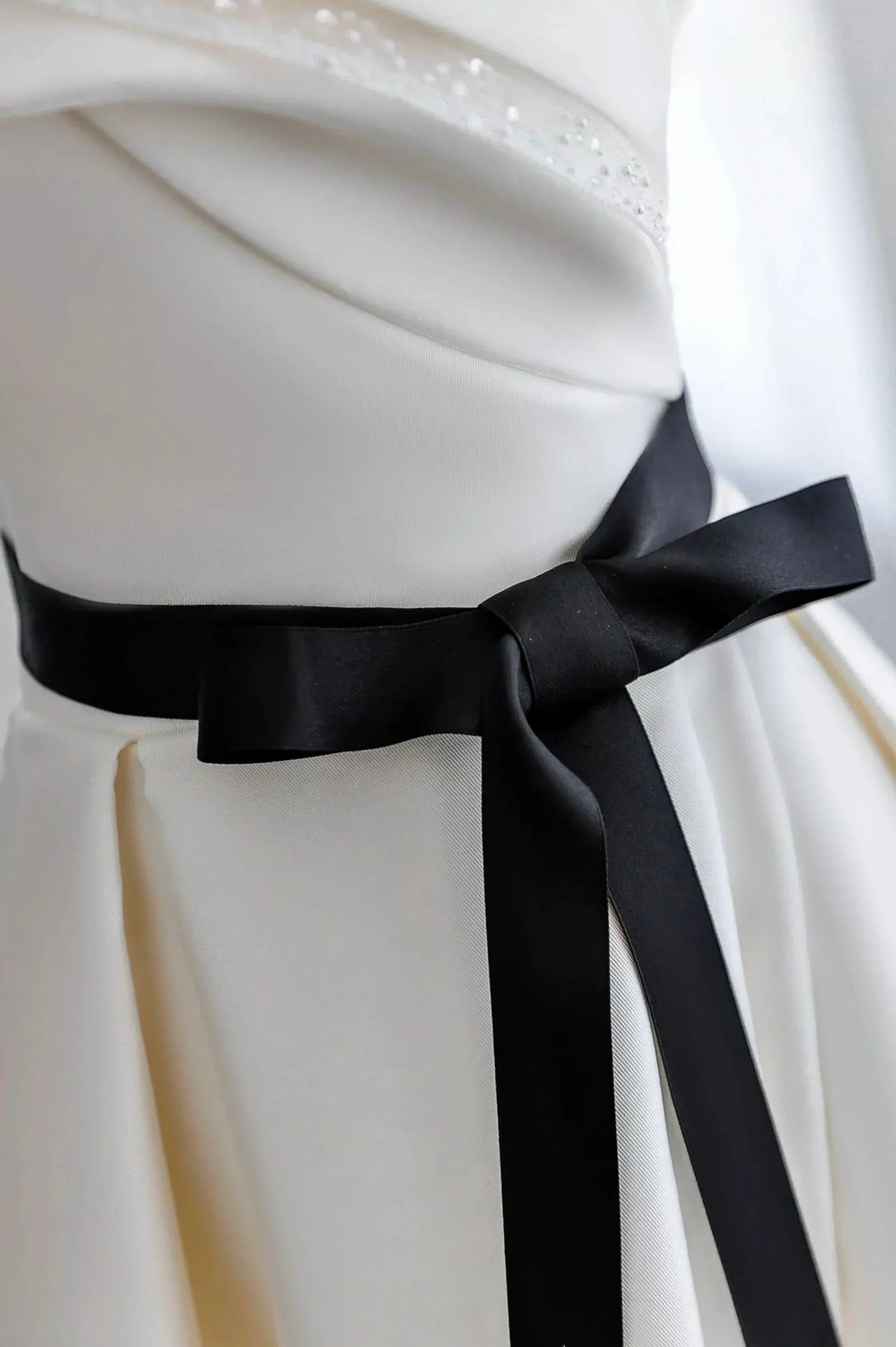 Ivory Off-the-Shoulder Satin A-Line Wedding Dress with Black Sash and Lace-Up Back