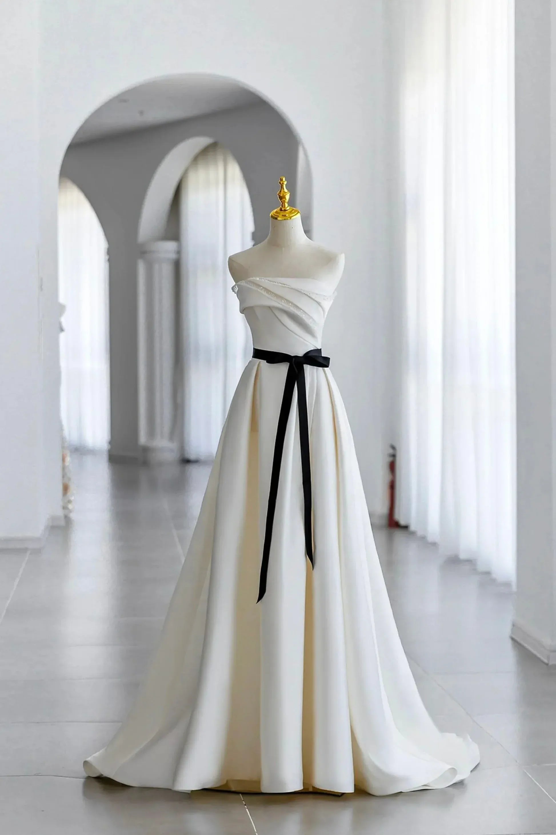 Ivory Off-the-Shoulder Satin A-Line Wedding Dress with Black Sash and Lace-Up Back