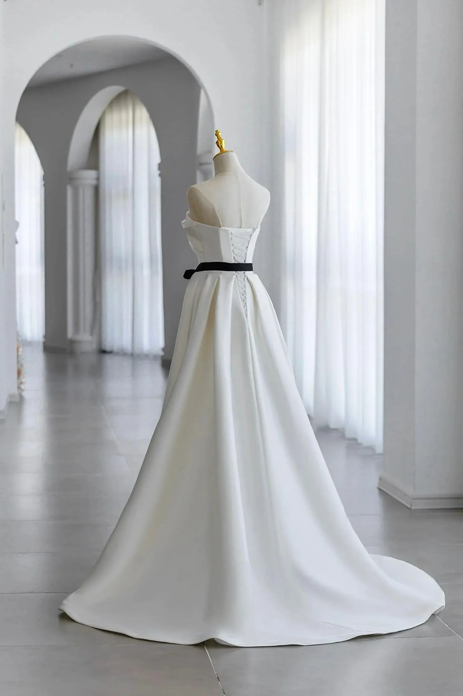 Ivory Off-the-Shoulder Satin A-Line Wedding Dress with Black Sash and Lace-Up Back