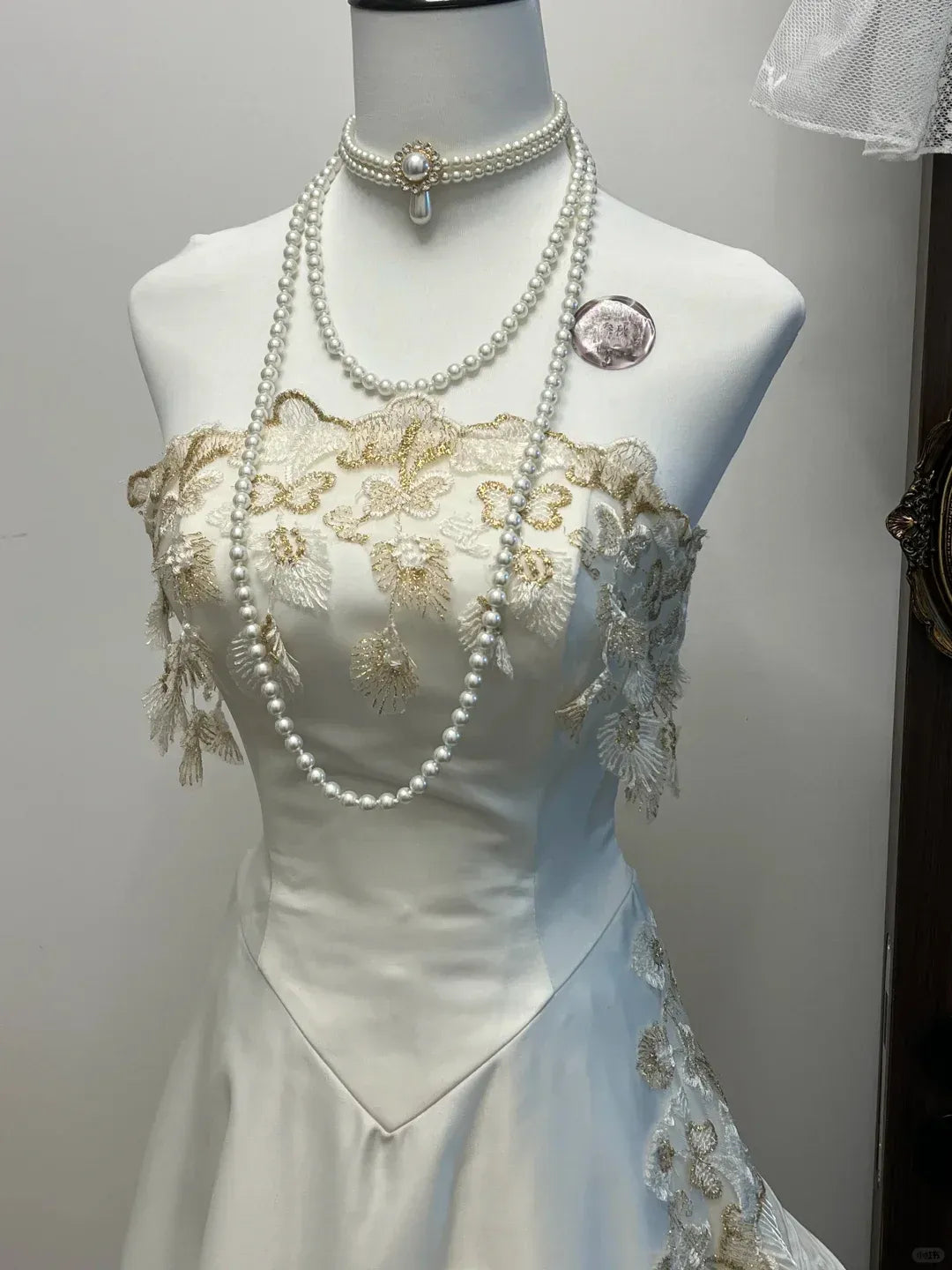Ivory Strapless Sweetheart Neckline Gold Lace Applique Satin Gown with Ruffled Tulle Panels