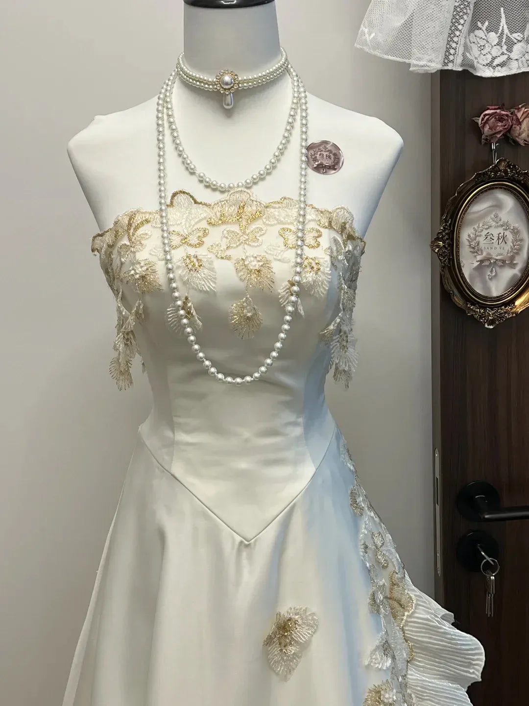 Ivory Strapless Sweetheart Neckline Gold Lace Applique Satin Gown with Ruffled Tulle Panels