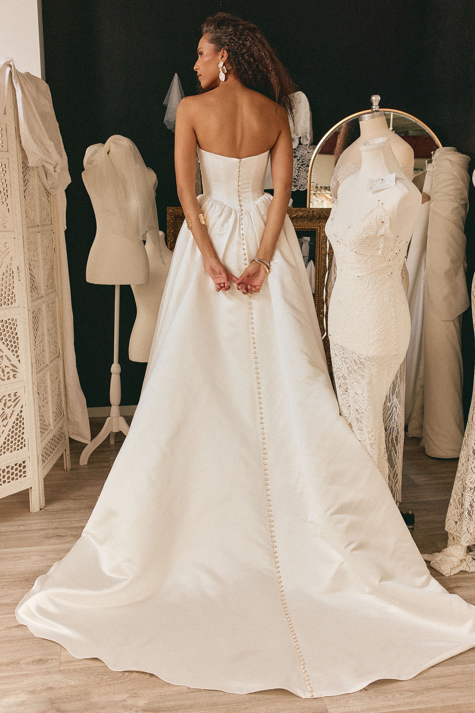 Modern Satin Wedding Dress with Strapless Neckline, Buttoned Back and Voluminous Train