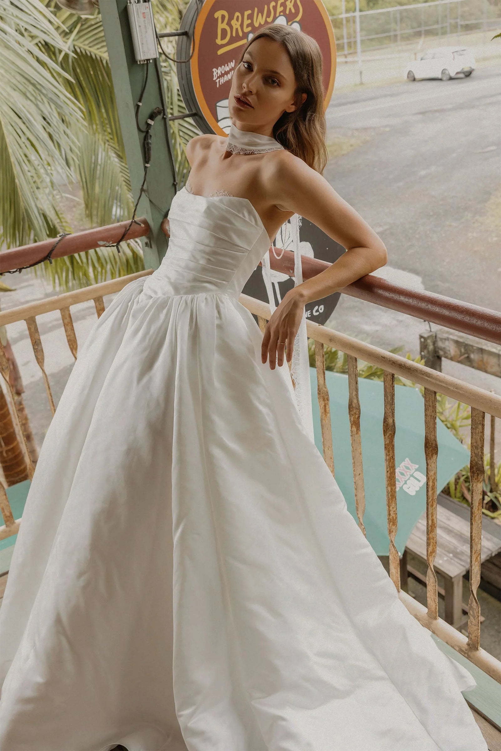 Modern Satin Wedding Dress with Strapless Neckline, Buttoned Back and Voluminous Train