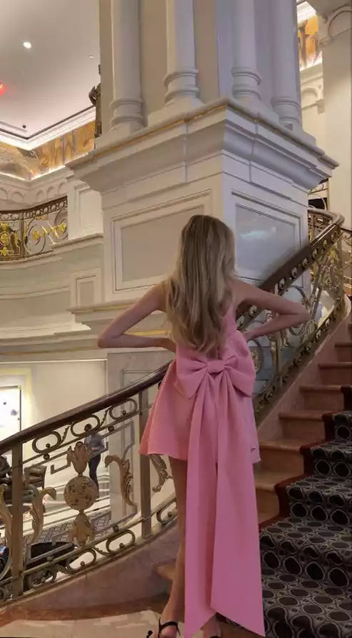 Playful Blush Pink Asymmetrical Mini Gown with Oversized Back Bow