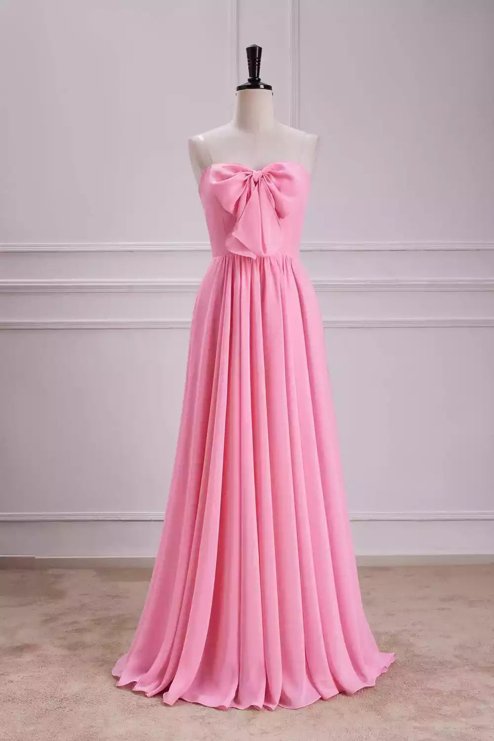Playful Hot Pink Chiffon Gown with Strapless Design & Oversized Bow