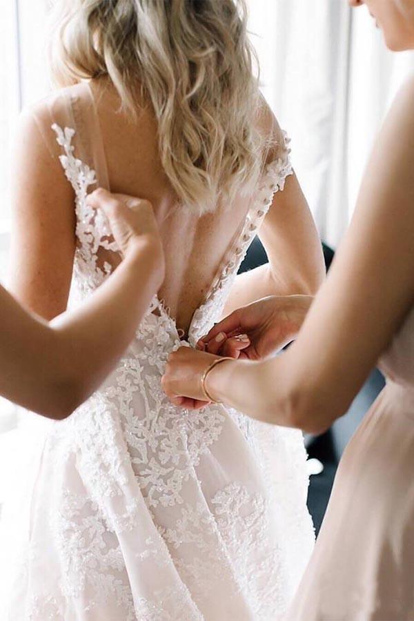 Romantic A-line wedding dress with illusion straps, beaded lace appliqué and chapel train