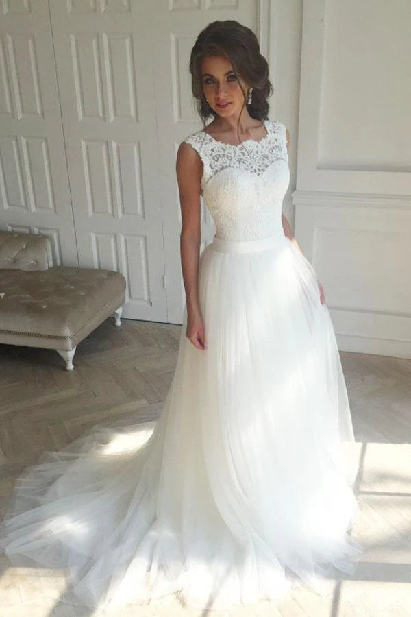Romantic lace and tulle wedding dress with illusion neckline, lace-up back and chapel train