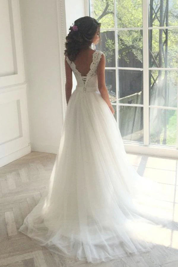 Romantic lace and tulle wedding dress with illusion neckline, lace-up back and chapel train