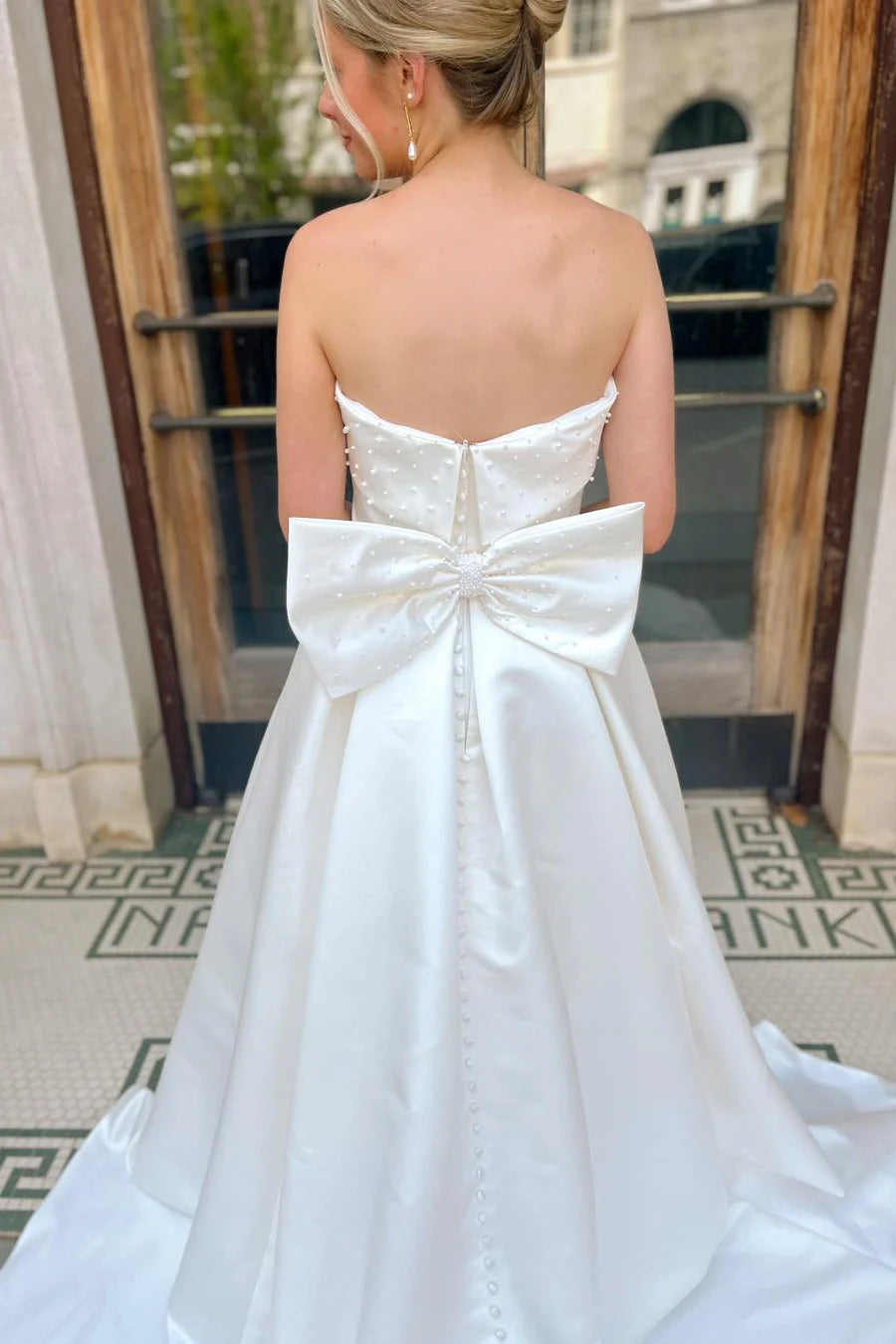 Strapless Satin Wedding Dress with Pearl Embellishment and Oversized Back Bow