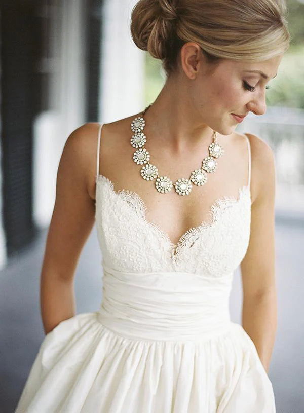 Timeless Wedding Dress with Lace Bodice and Voluminous Satin Ball Gown Skirt