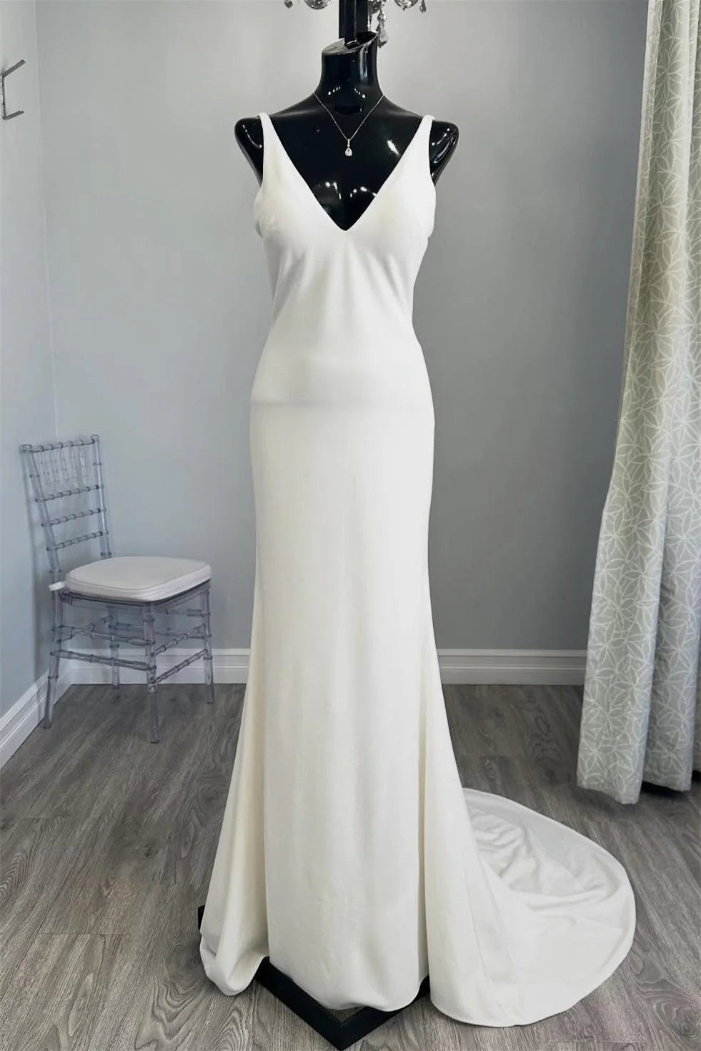 White Minimalist Mermaid Wedding Dress with Deep V Neck and Buttoned Back Train