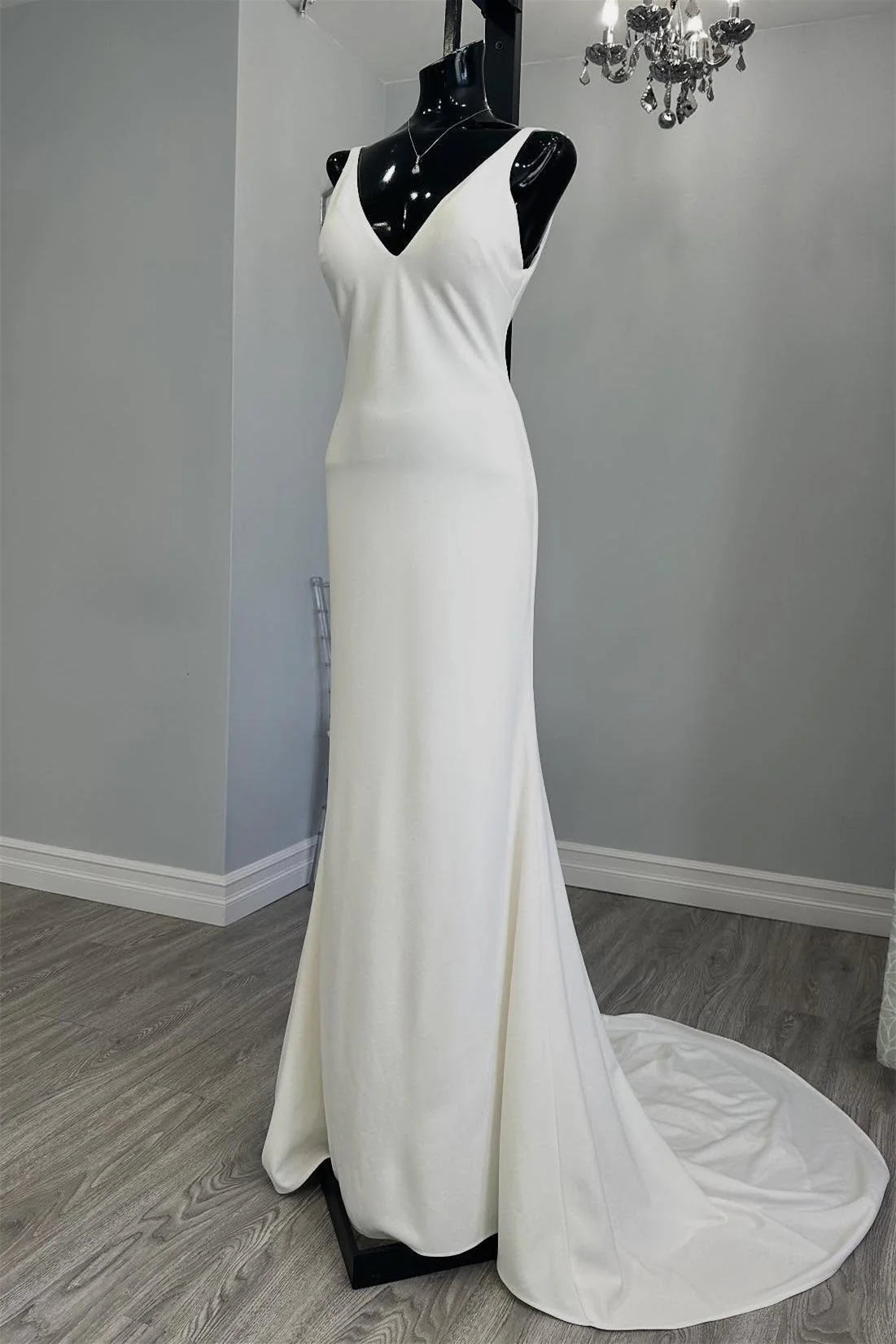 White Minimalist Mermaid Wedding Dress with Deep V Neck and Buttoned Back Train
