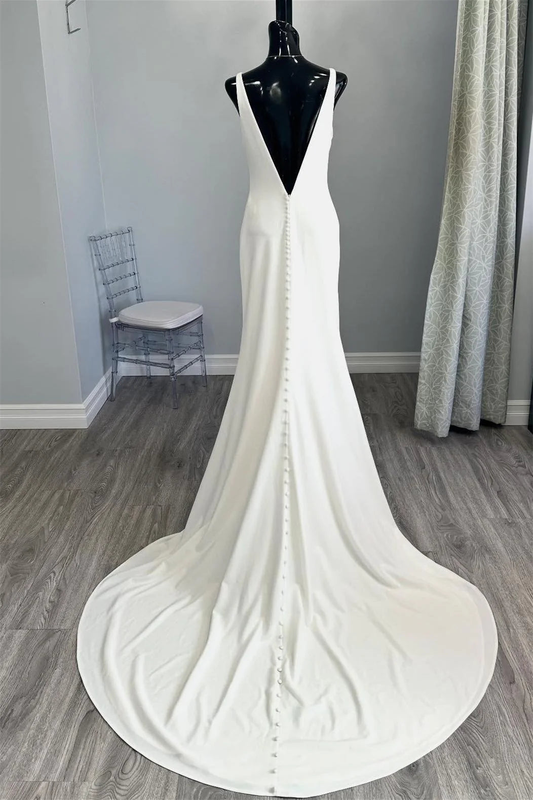 White Minimalist Mermaid Wedding Dress with Deep V Neck and Buttoned Back Train