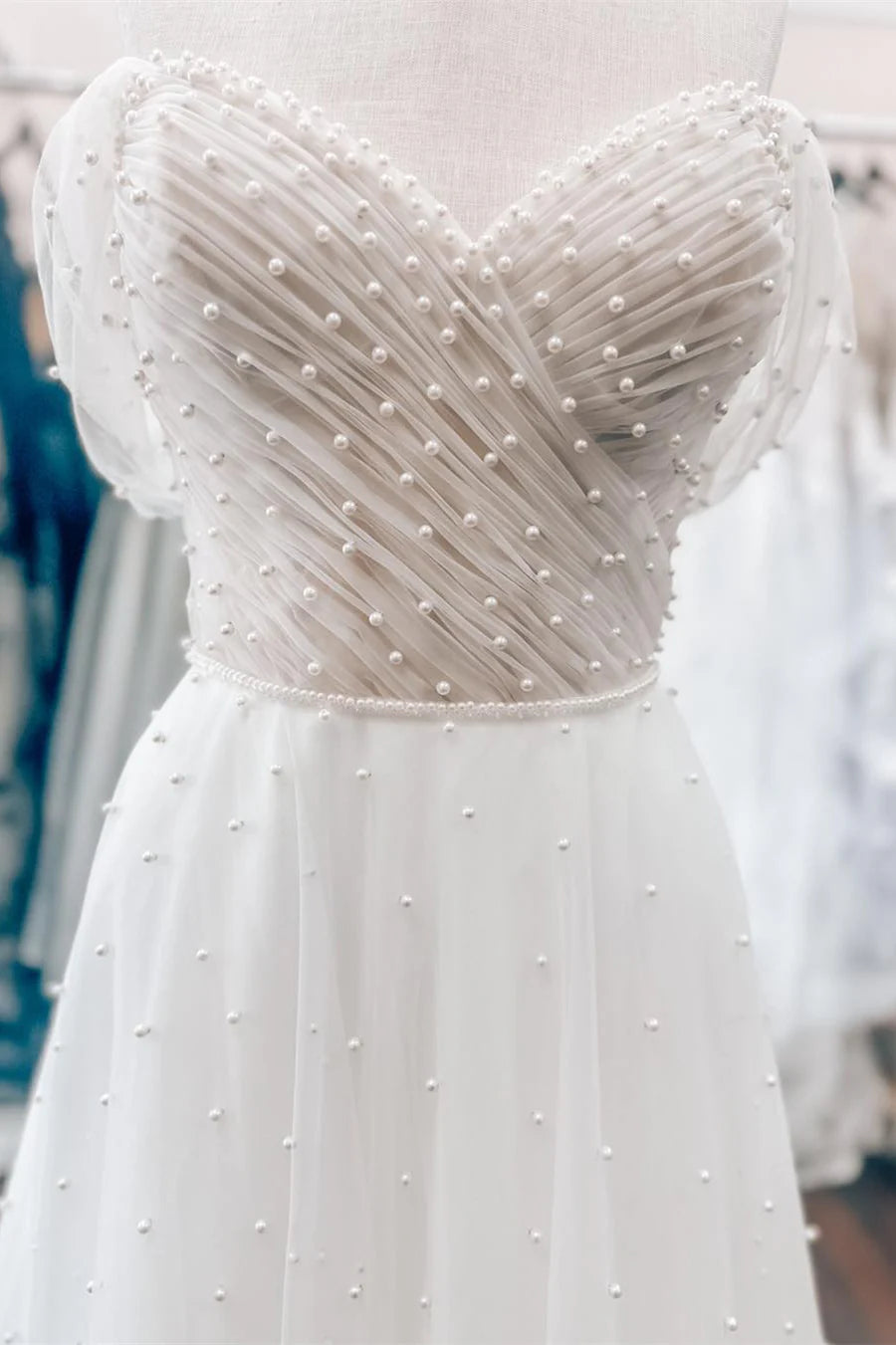 White Off-the-Shoulder Wedding Dress with Pearl Embellishments and Tulle Train