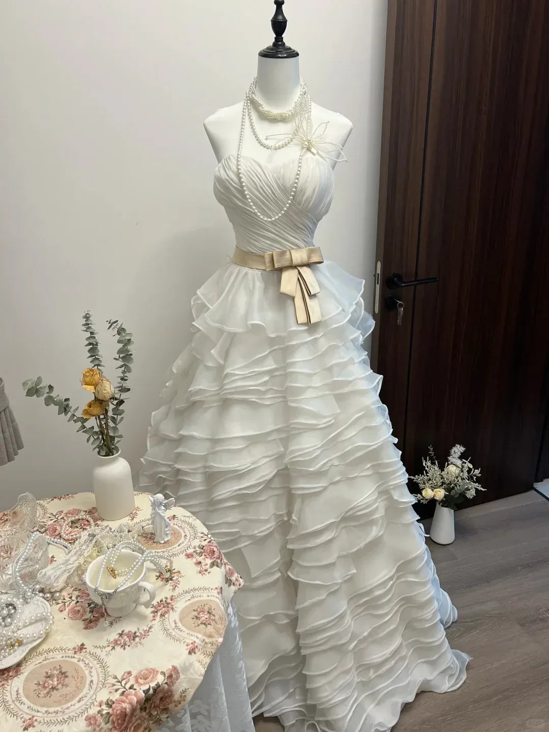 White Strapless Sweetheart Neckline Ruffled Tulle Gown with Champagne Satin Bow