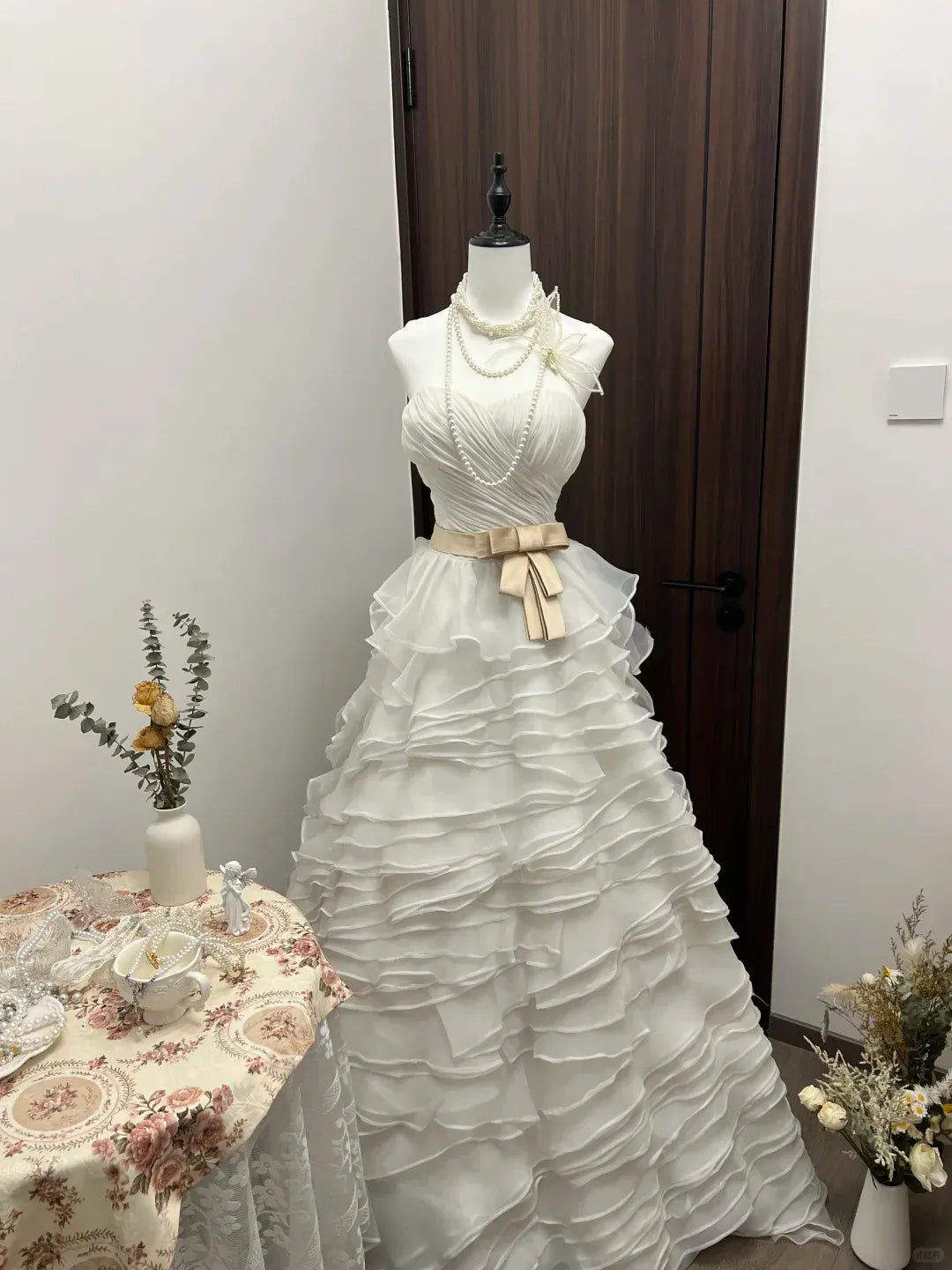 White Strapless Sweetheart Neckline Ruffled Tulle Gown with Champagne Satin Bow